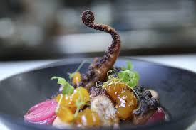 Viaggio Ristorante signature dishes  House-Made Pastas (e.g., Tagliatelle Bolognese, Agnolotti), Wood-Fired Octopus, Seasonal Risotto, Pollo Scarpariello.